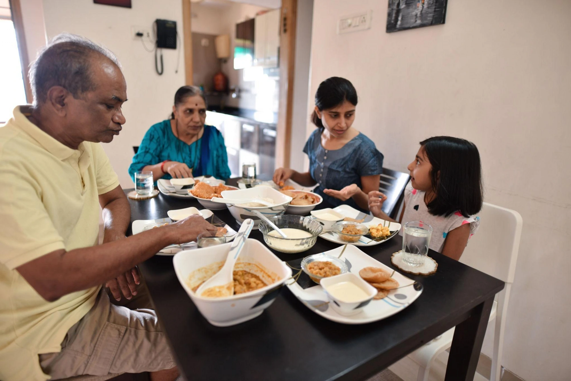 Three generations eating lunch together at home